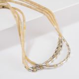 Nick Rosetta Three Strand Yellow Serpentine Heishi Necklace